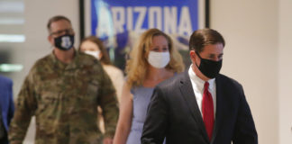 Many Arizona cities back masks to slow virus, others say no