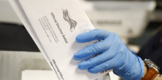 Wealthy donors pour millions into fight over mail-in voting